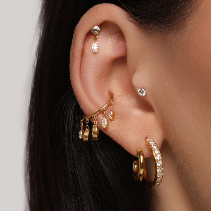 Dangling Conch Piercing | Titan